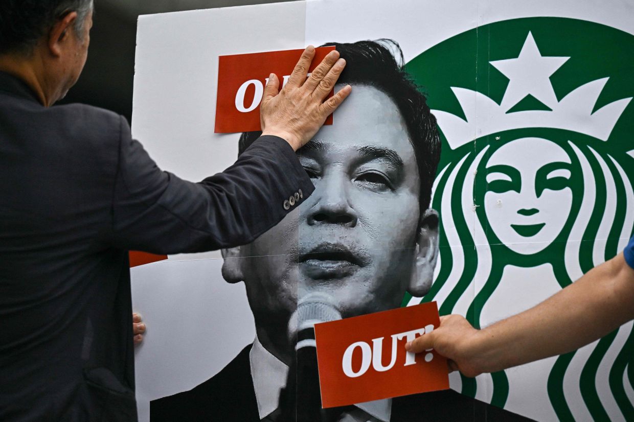 South Korean police question Starbucks executive over 'Tank Day' marketing disaster