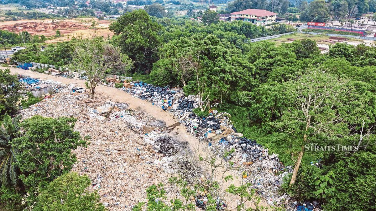 Johor launches task force to probe suspected Singapore construction waste dumping in Pontian