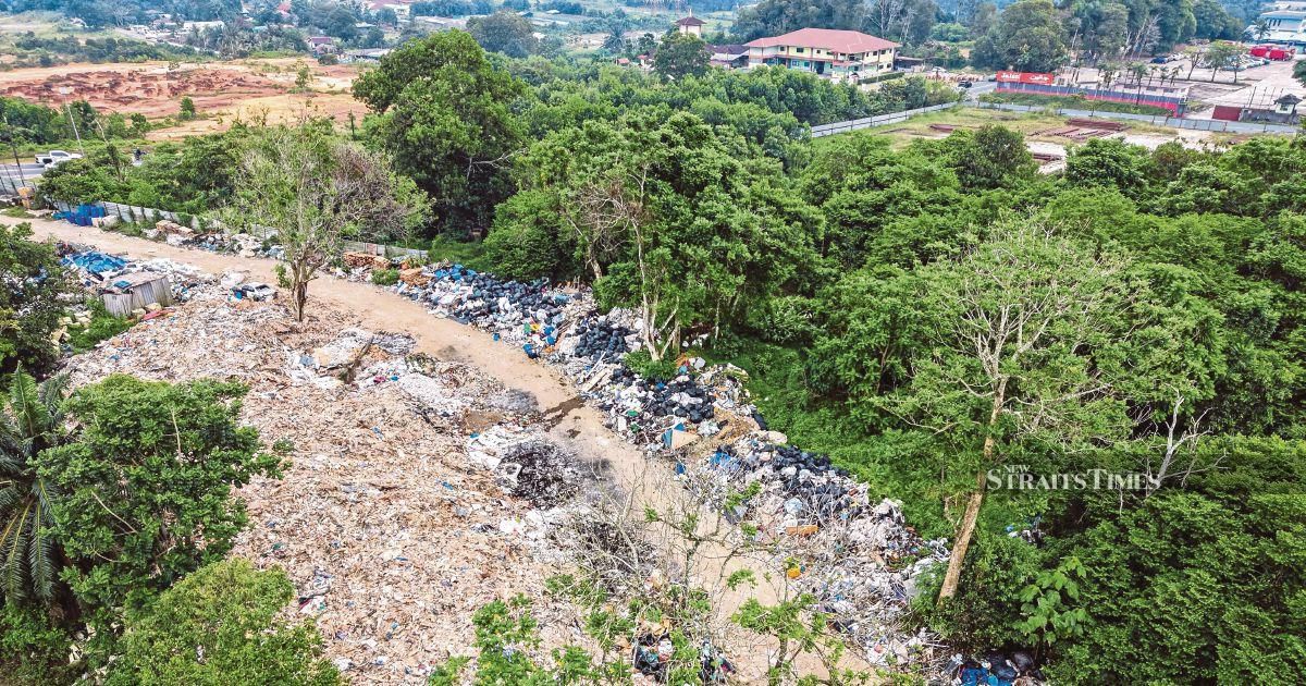 Johor launches task force to probe suspected Singapore construction waste dumping in Pontian