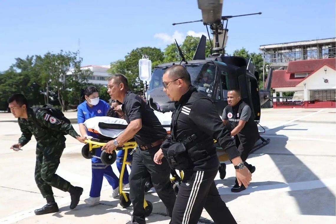 Twin bomb attacks wound dozen Thai police in volatile southern provinces