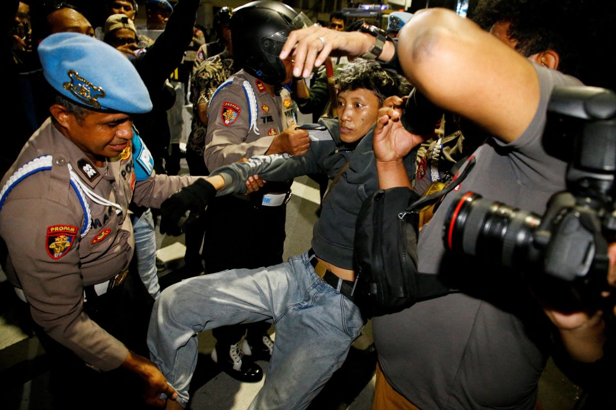 Indonesia charges four protesters after anti-government rally in Surabaya
